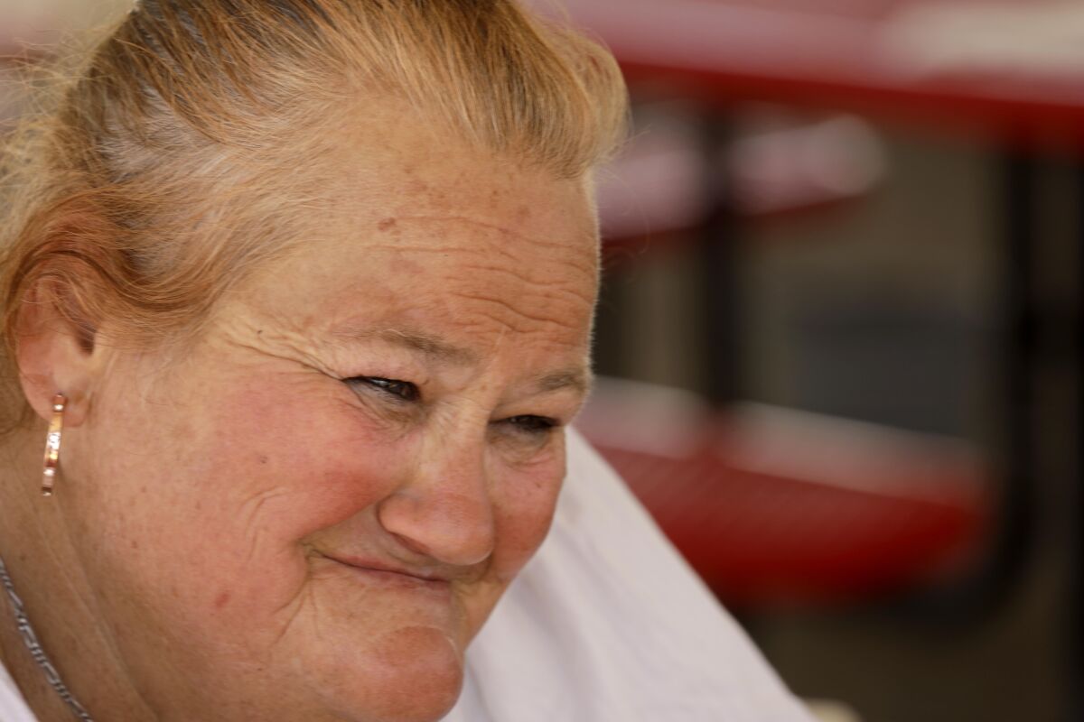 A close-up of a woman smiling.