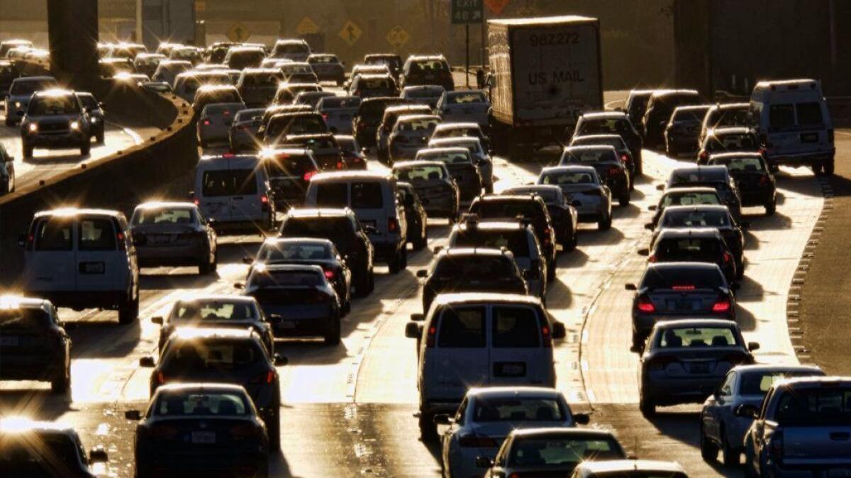 Rush-hour traffic makes its way along the 101 Freeway in downtown Los Angeles.