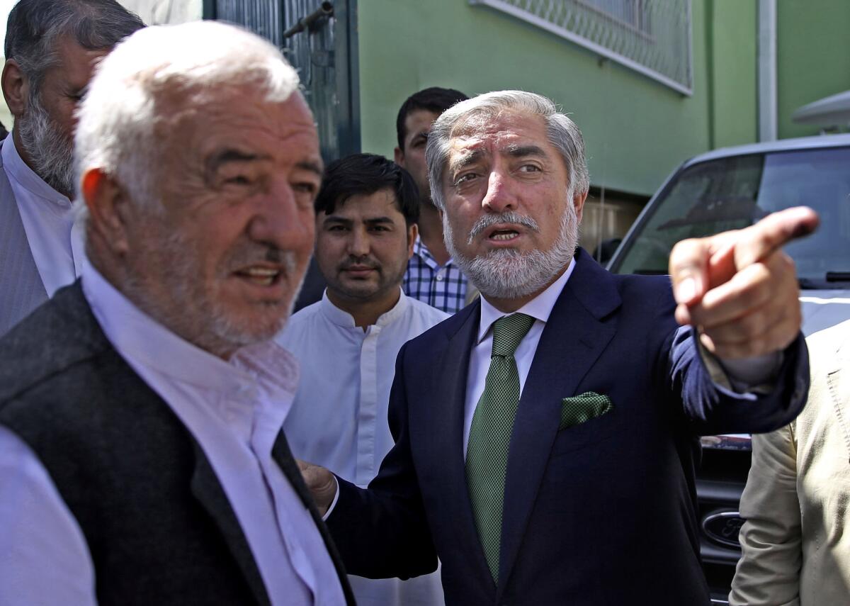 Afghanistan presidential candidate Abdullah Abdullah, right, after a news conference in Kabul, Afghanistan.
