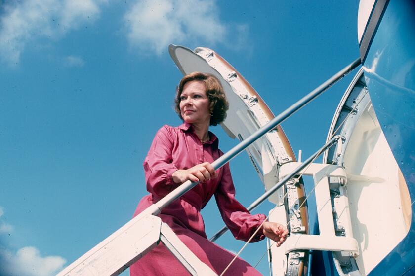US First Lady Rosalynn Carter climbs the steps to her plane during a trip, Texas, September 1978.