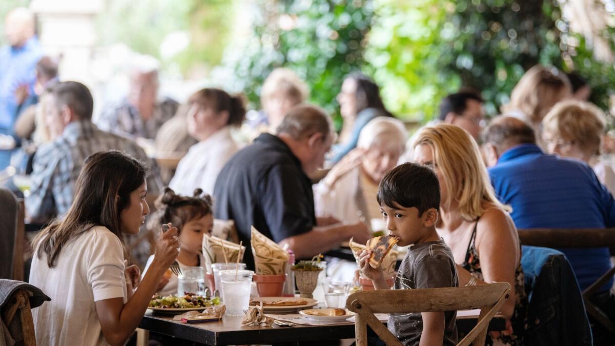 Diners at Farmhouse at Roger's Gardens, a popular farm-to-table restaurant in Corona del Mar.
