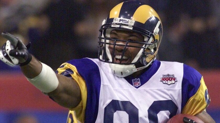 St. Louis Rams wide receiver Torry Holt reacts after making a 9-yard touchdown catch in the third quarter against the Tennessee Titans in Super Bowl XXXIV in Atlanta on Jan. 30, 2000. The Rams beat the Titans, 23-16.