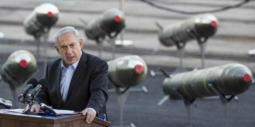 Israeli Prime Minister Benjamin Netanyahu speaks to the media in the southern Israeli port of Eilat as Israel displayed advanced rockets seized from a Panamanian-flagged vessel allegedly transporting arms from Iran to the Gaza Strip.