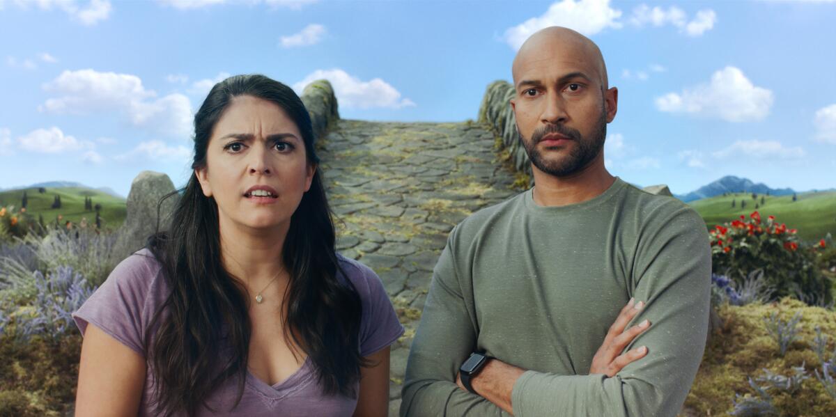 Cecily Strong and Keegan-Michael Key with a fantasy-world stone footbridge behind them.