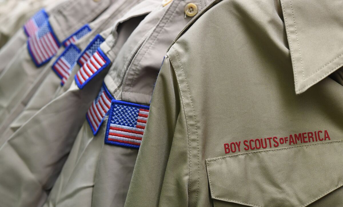 FILE - In this Feb. 18, 2020, file photo, Boy Scouts of America uniforms are displayed in the retail store at the headquarters for the French Creek Council of the Boy Scouts of America in Summit Township, Pa. Close to 90,000 sex-abuse claims have been filed against the Boy Scouts of America as the deadline arrived Monday, Nov. 16 for filing claims in the BSA’s bankruptcy case. The number far exceeded initial projections of lawyers across the United States who have been signing up clients in the case since the Boy Scouts filed for bankruptcy protection in February in the face of hundreds of lawsuits. (Christopher Millette/Erie Times-News via AP, File)