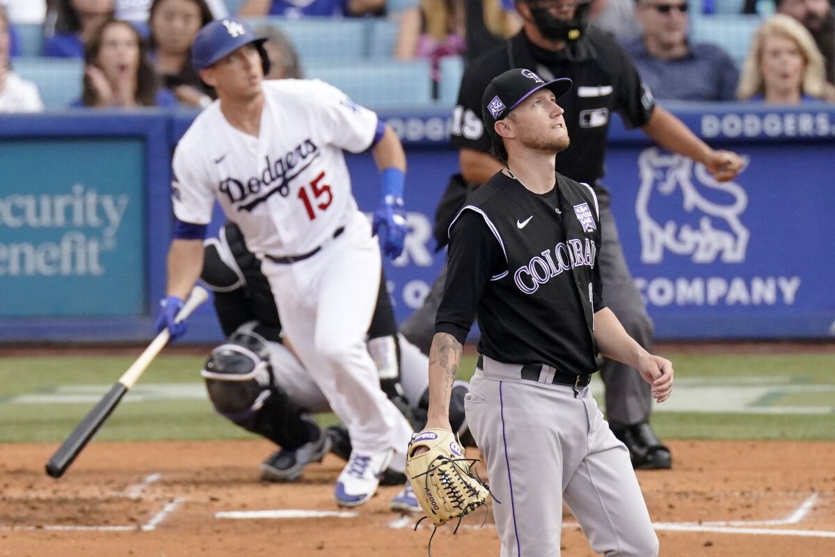 The Dodgers' Austin Barnes runs after homering off Rockies starter Kyle Freeland in the second inning.