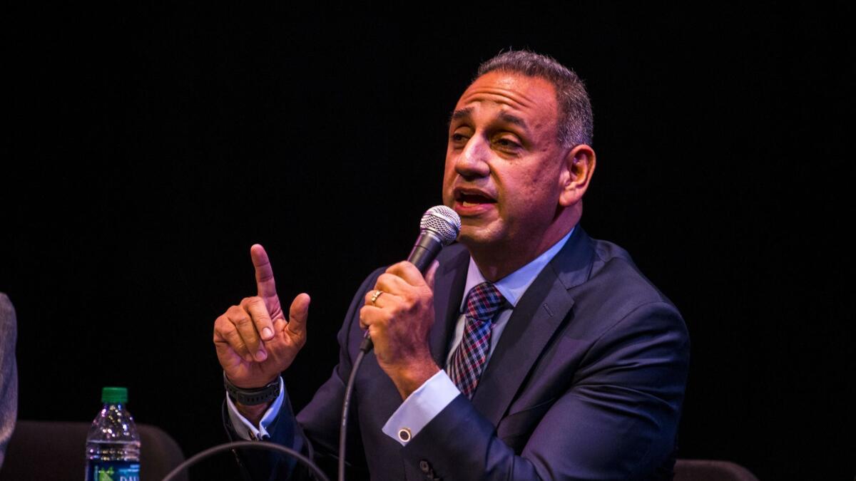 Gil Cisneros, a Democrat running in the 39th Congressional District, speaks at a candidate forum in January.