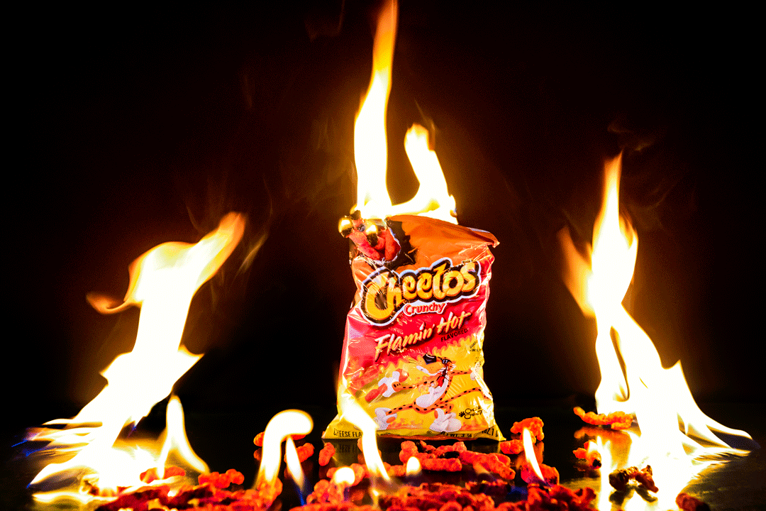 Animated clip of Flamin' Hot Cheetos engulfed by flames.