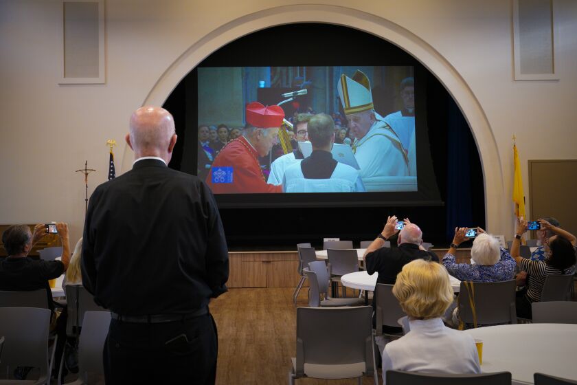 Coronado, CA - August 27: On Saturday, Aug. 27, 2022 at the Sacred Heart Catholic Church in Coronado, CA., Father Michael Murphy hosted a watch party to view Robert W. McElroy get elevated to cardinal. McElroy kneeled before Pope Francis to receive the red biretta and the cardinal's ring at St. Peter’s Basilica. (Nelvin C. Cepeda / The San Diego Union-Tribune)