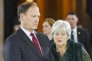 FILE - Supreme Court Justice Samuel Alito Jr., left, and his wife Martha-Ann Alito, pay their respects at the casket of Reverend Billy Graham at the Rotunda of the U.S. Capitol Building in Washington, Feb. 28, 2018. (AP Photo/Pablo Martinez Monsivais, File)