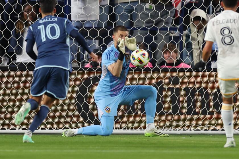 KANSAS CITY, KS - MARCH 23: Los Angeles Galaxy goalkeeper John McCarthy (77) makes a save in the first half of an MLS match between the LA Galaxy and Sporting Kansas City on Mar 23, 2024 at Children's Mercy Park in Kansas City, KS.(Photo by Scott Winters/Icon Sportswire via Getty Images)