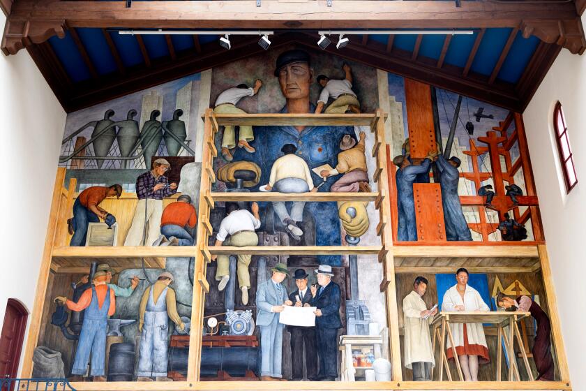 "The Making of a Fresco Showing the Building of a City" painted by Diego Rivera in 1931 sits in a private gallery at San Francisco Art Institute in San Francisco, Calif. Wednesday, July 20, 2022. The mural recently underwent restoration, but the gallery is closed indefinitely along with the school which recently announced its permanent closure. (Jessica Christian/San Francisco Chronicle via AP)