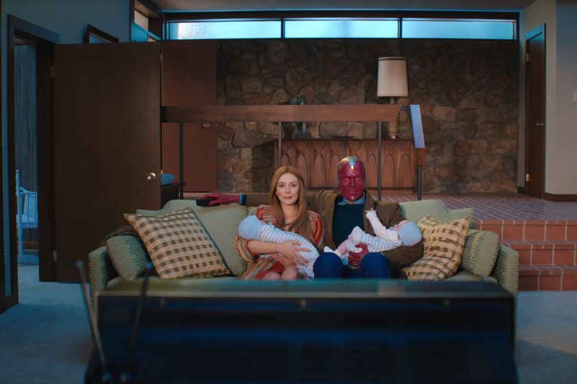 (L-R): Elizabeth Olsen as Wanda Maximoff and Paul Bettany as Vision in Marvel Studios' WANDAVISION
