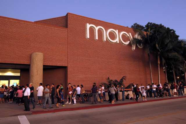 A line of fans extends outdoors during an event at Macy's South Coast Plaza to meet Landon Donovan of the L.A. Galaxy.