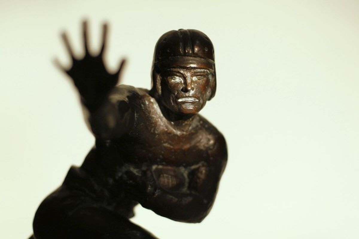 The first 1935 Downtown Athletic Club trophy. Following the death of John Heisman in 1936, the award was renamed the Heisman Memorial Trophy.
