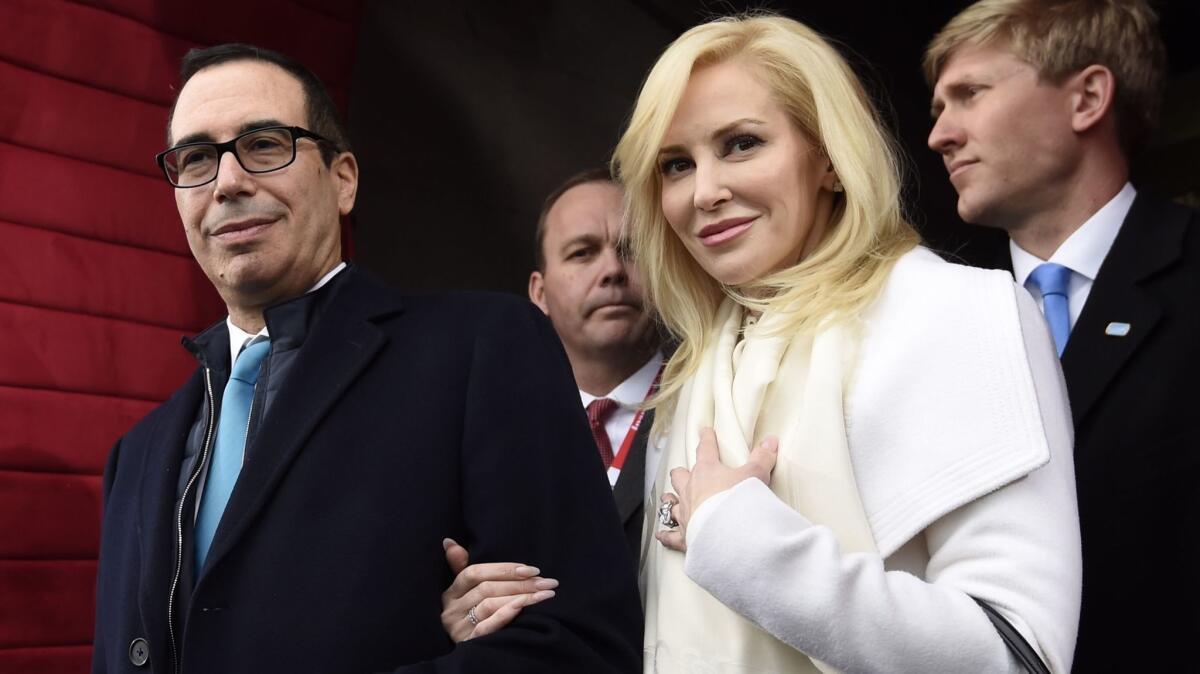 In this Jan. 20, 2017, Stephen T. Mnuchin and then-fiancee Louise Linton arrive on Capitol Hill in Washington for the presidential inauguration.
