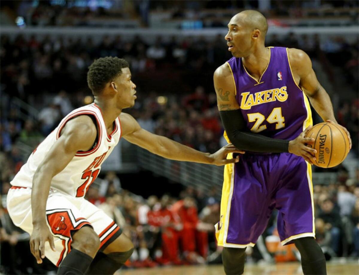 Chicago Bulls swingman Jimmy Butler defends Lakers guard Kobe Bryant.