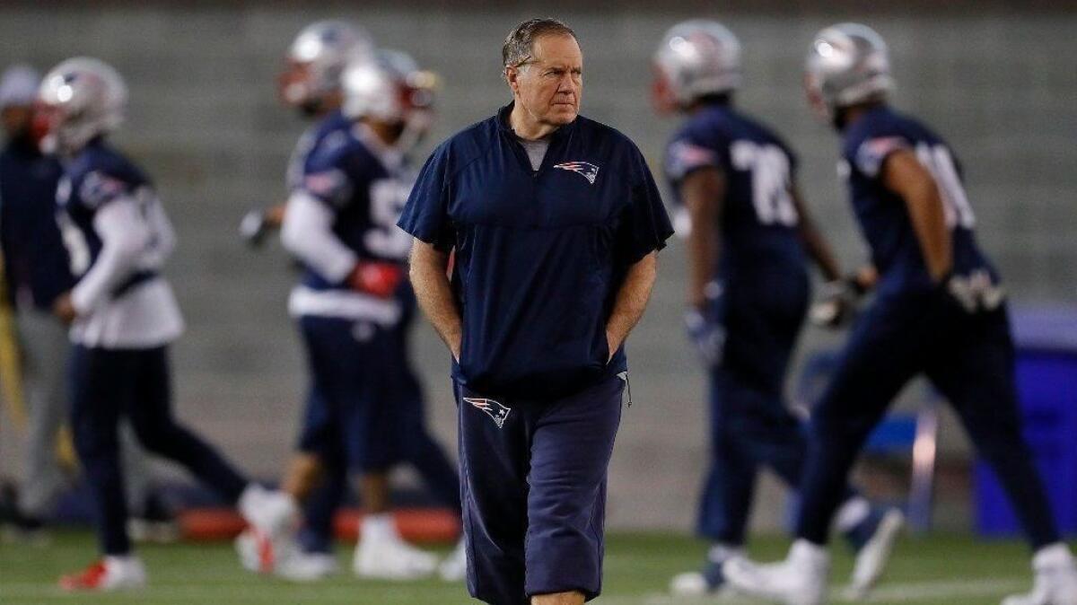 Patriots coach Bill Belichick walks on the field during a team practice session Friday ahead of Sunday's game against the Rams in Super Bowl LIII.