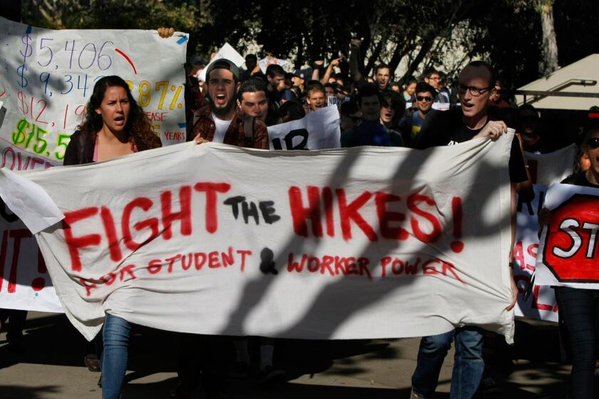 NOVEMBER 24, 2014. SAN DIEGO, CA. In a loud but peaceful march, students march through the campus of U.S. San Diego on Nov 24, 2014 as part of a systemwide day of action protesting a proposed tuition increase. (Don Bartletti / Los Angeles Times)