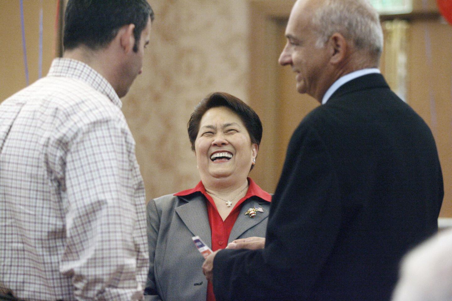 Former Glendale zoning administrator Edith Fuentes, center, is greeted by Tony Tartaglia, left, and former mayor of Glendale Bob Yousefian during her campaign kickoff for city council at Hilton in Glendale on Thursday, September 20, 2012.