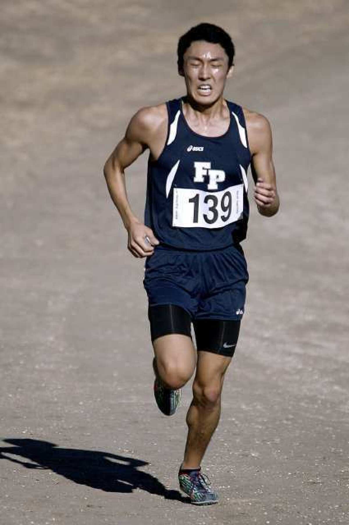 ARCHIVE PHOTO: Flintridge Prep's Aaron Sugimoto leaves the competition behind to win the Prep League Boys Varsity Cross-Country race at Pierce College in Woodland Hills on Saturday, Oct. 27, 2012. The Flintridge Prep boys won the league title as well.