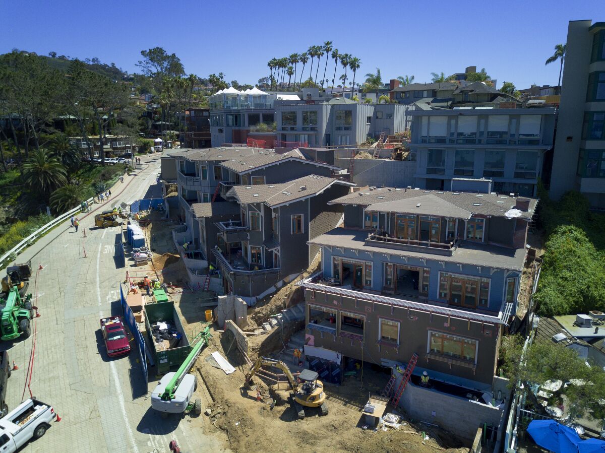 Three detached townhomes under construction on Coast Blvd in La Jolla.
