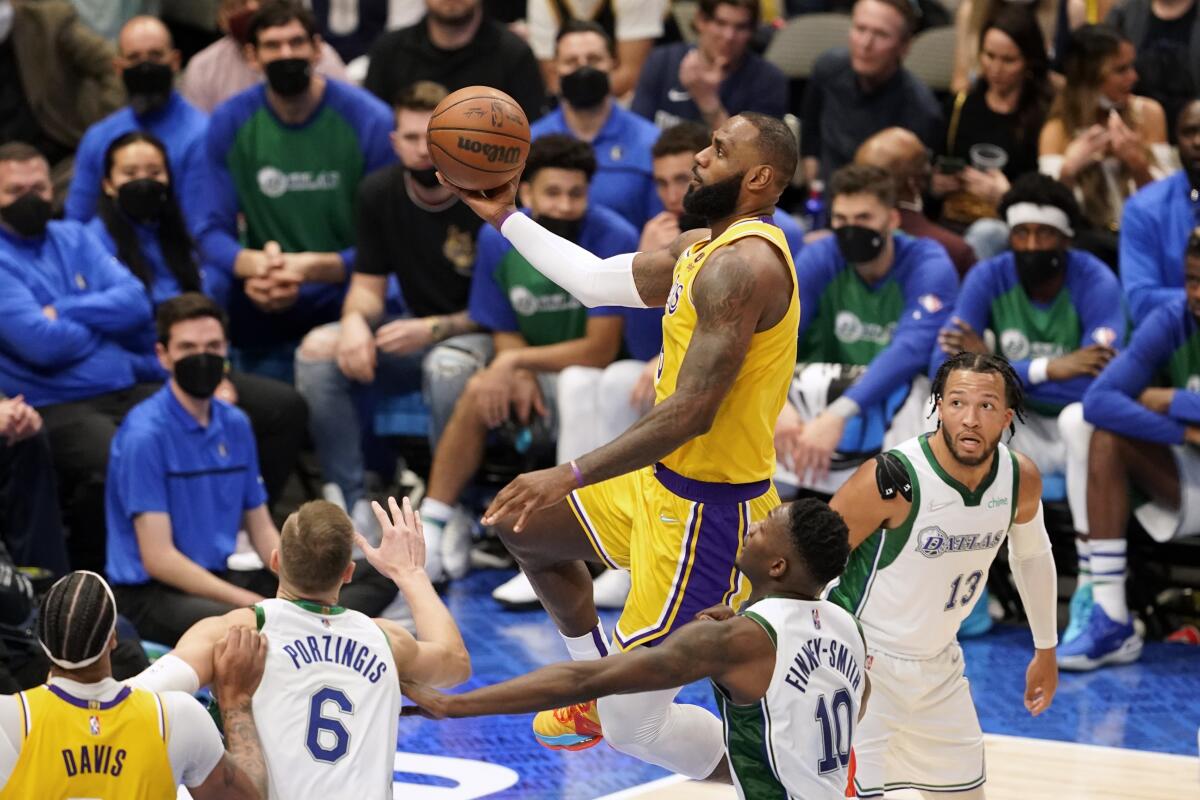 Lakers star LeBron James goes in for a layup against the Dallas Mavericks in the second half.