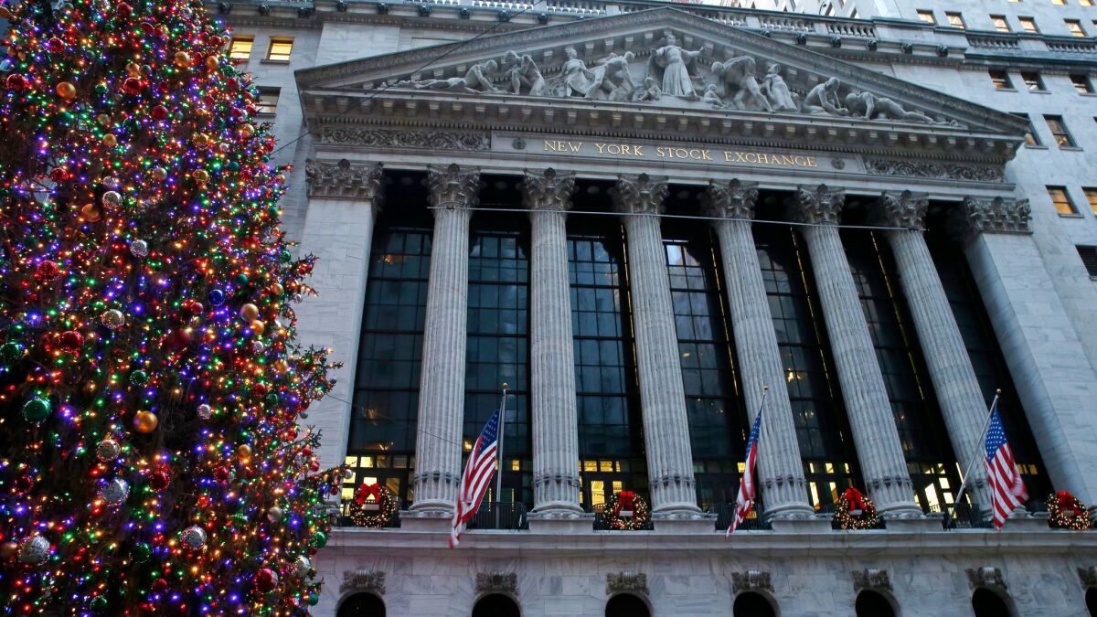 Christmas decorations adorn the facade of the New York Stock Exchange.