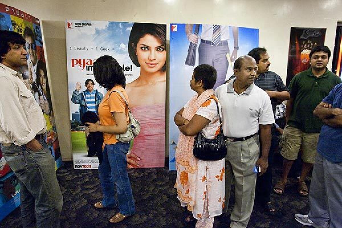 Moviegoers line up in the lobby of San Jose's Towne Theatre, which features Indian movies exclusively. Operator Big Cinemas aims to build the nation's first theater circuit catering to Indian Americans and other ethnic groups passed over by the major chains.