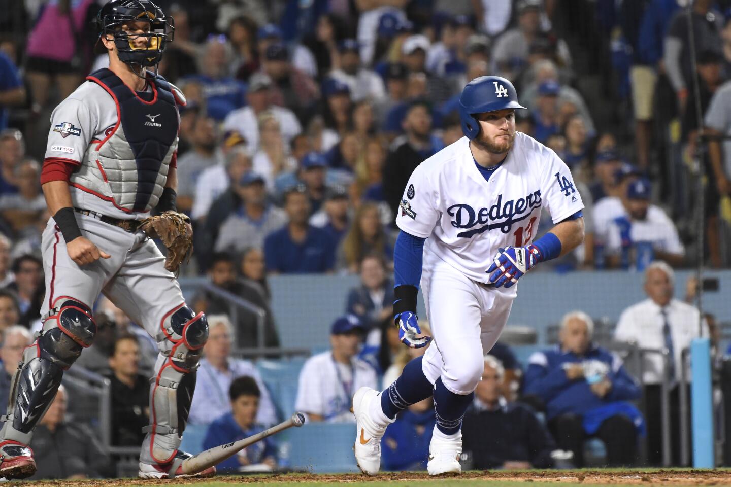 Dodgers second baseman Max Muncy hits a run-scoring double against the Nationals in the fifth inning.