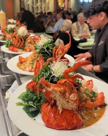 Lunar New Year specials at Chinois On Main include Shanghai lobster with curry sauce and crispy spinach.