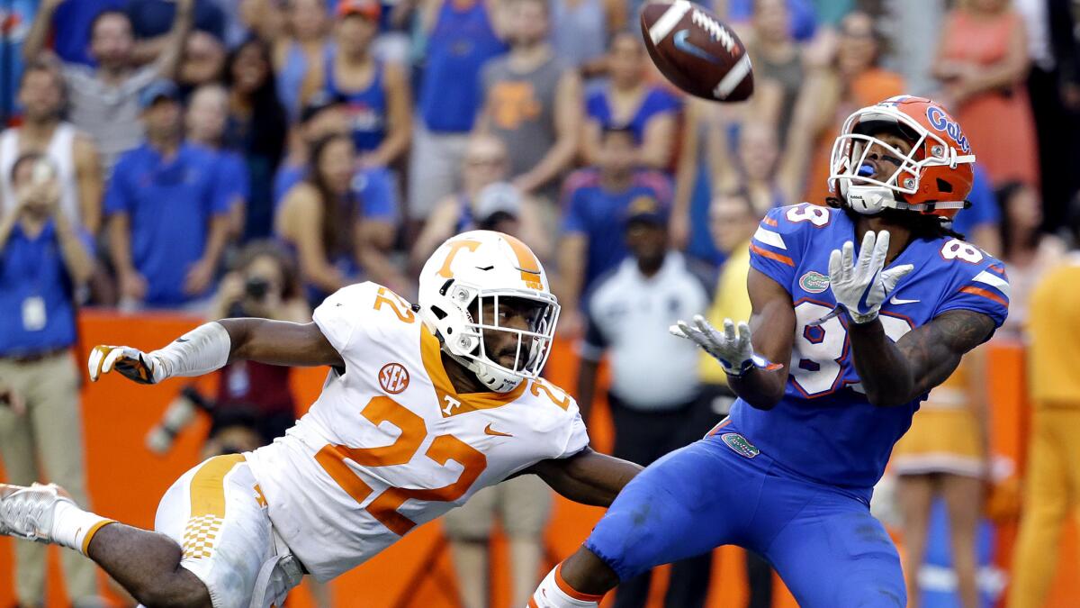 Florida wide receiver Tyrie Cleveland prepares to make the game-winning touchdown catch against Tennessee defensive back Micah Abernathy as time expired Saturday.