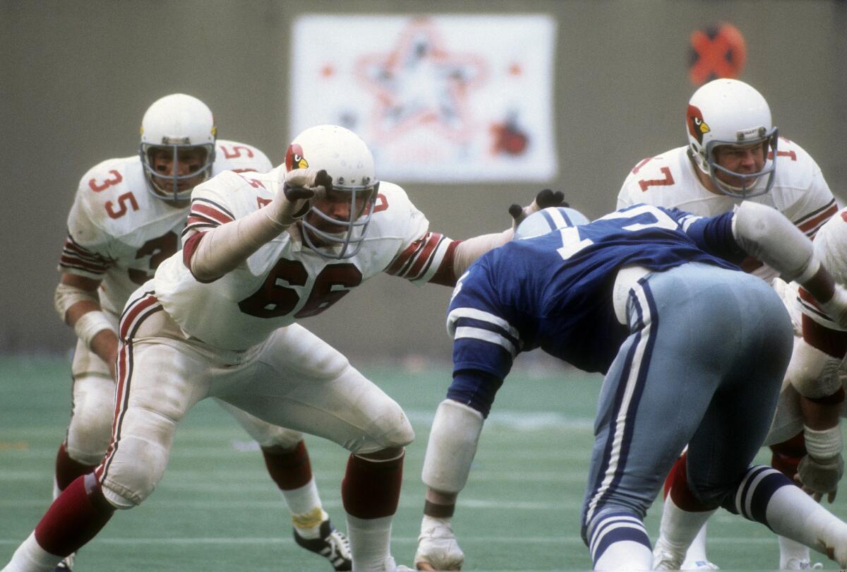 ST. LOUIS, MO - CIRCA 1972: Conrad Dobler #66 of the St. Louis Cardinals in action against Jethro Pugh #75 of the Dallas Cowboys during an NFL football game at Busch Stadium circa 1972 in St. Louis, Missouri. Dobler played for the Cardinals from 1972-77. (Photo by Focus on Sport/Getty Images) ** TCN OUT **