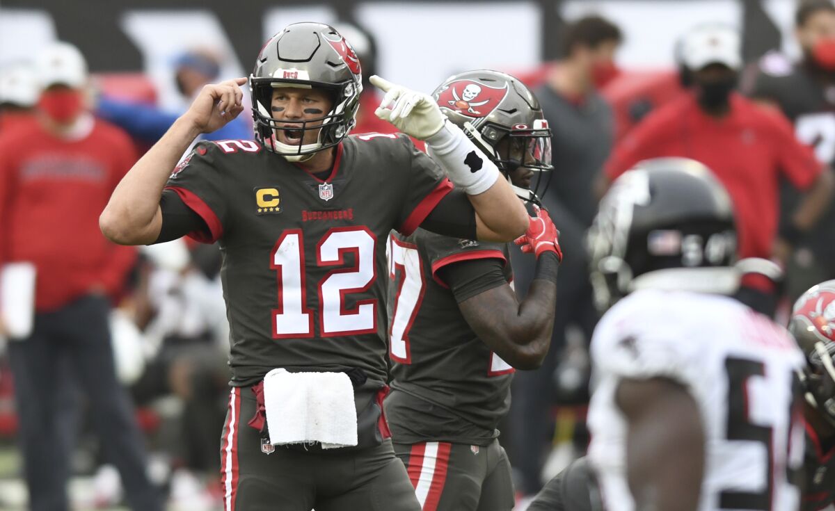 Tampa Bay Buccaneers quarterback Tom Brady (12) calls a play against the Atlanta Falcons during the second half of an NFL football game Sunday, Jan. 3, 2021, in Tampa, Fla. (AP Photo/Jason Behnken)