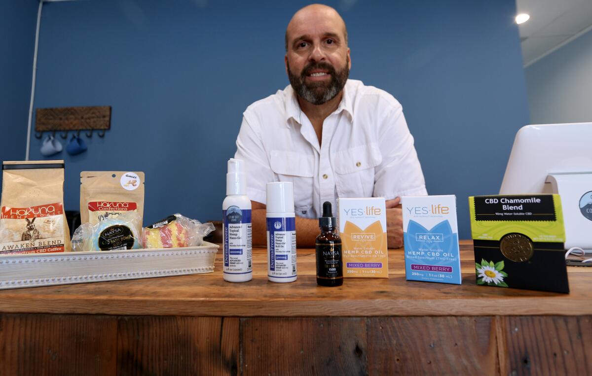 Stu Meyer, owner of CBD Comfort Zone, shows off some of the wares available at his Montrose store that opened in September.