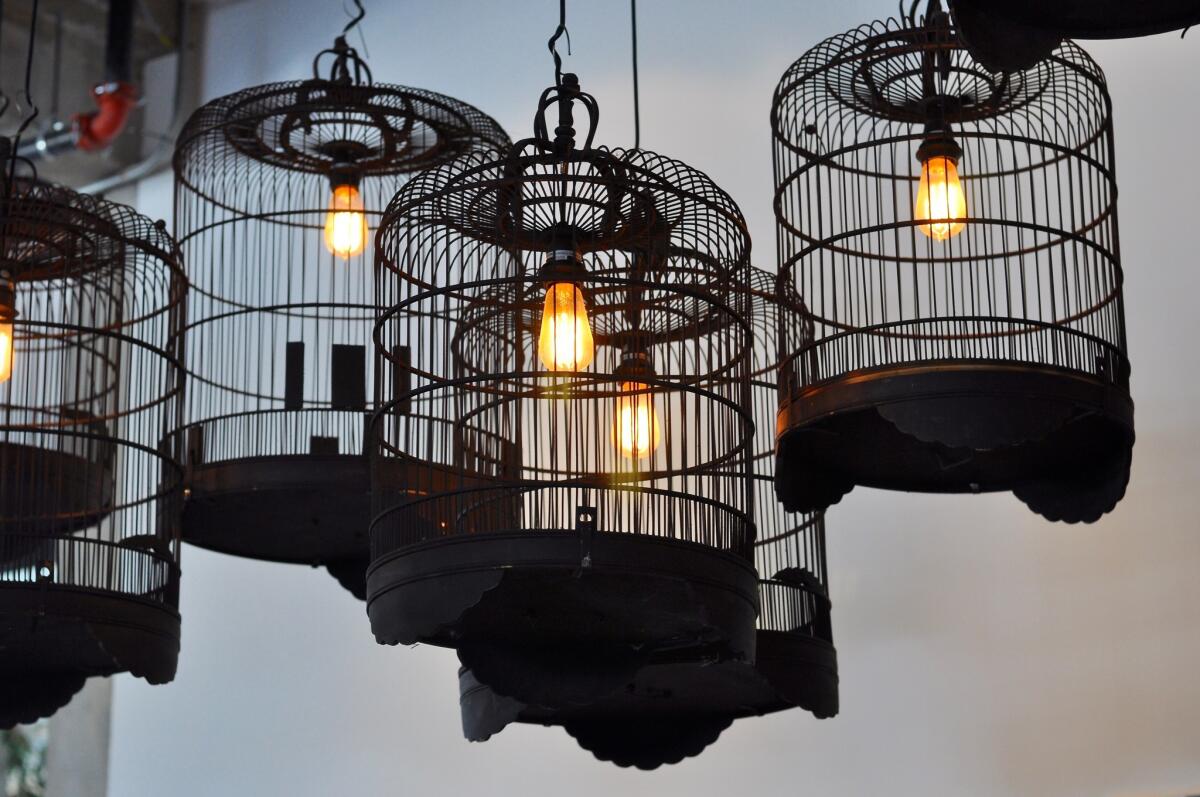 Chef Bryant Ng brought the bird cage light fixtures from Spice Table, which closed in 2013, to Cassia, his new restaurant with wife Kim Luu-Ng and Josh Loeb and Zoe Nathan.