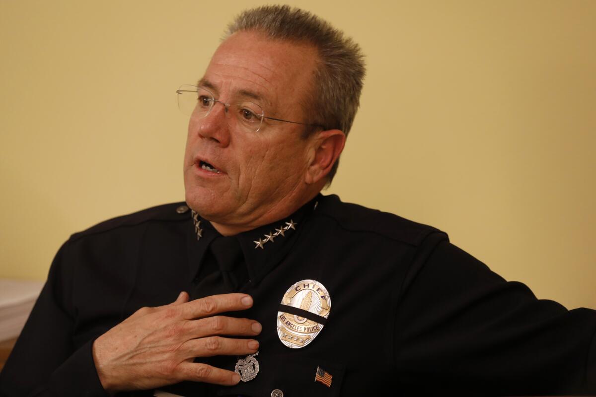 LAPD Chief Michel Moore discusses the LAPD gang-framing scandal with the Cease Fire collective, which includes community leaders, parents, gang interventionists and other members of law enforcement, on Jan. 11.