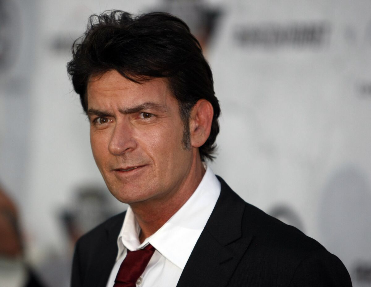 Charlie Sheen's ex-fiancee obtained a temporary restraining order against the star, two days after Los Angeles Police Department officials confirmed that he was under investigation for an alleged threat he made against her.