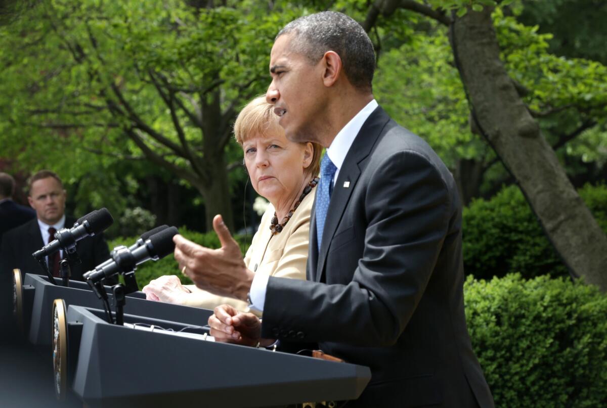President Obama and German Chancellor Angela Merkel hold a joint news conference in the Rose Garden at the White House.