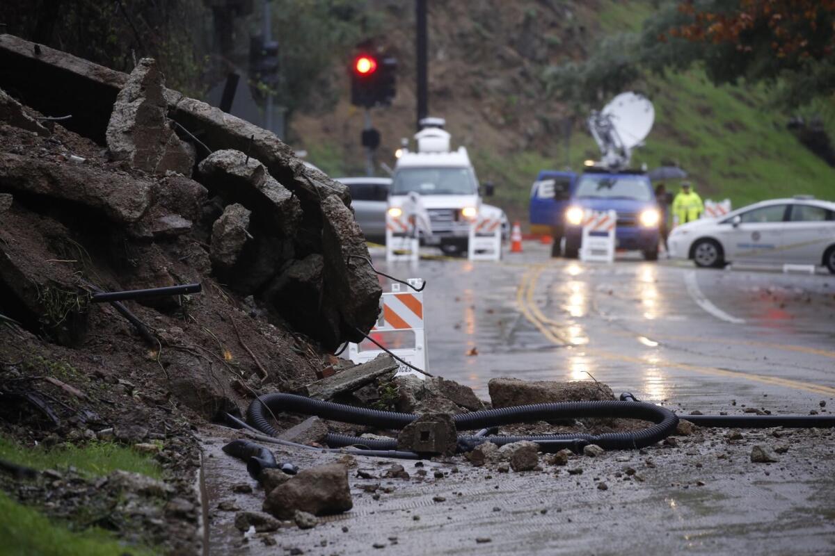 Laurel Canyon Blvd. remained closed in both directions Thursday morning, after a 9,000-pound slab of concrete from a foundation came tumbling on to the road.