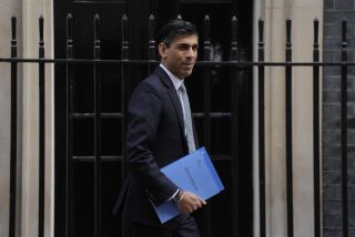 FILE - Rishi Sunak, Britain's Chancellor of the Exchequer poses for the media as he leaves 11 Downing Street in London, Wednesday, March 23, 2022. Sunak has defended his wife’s decision to take advantage of rules that allow many foreigners to escape U.K. taxes on their overseas income, saying critics have launched a smear campaign against her to get at him. (AP Photo/Alastair Grant, File)
