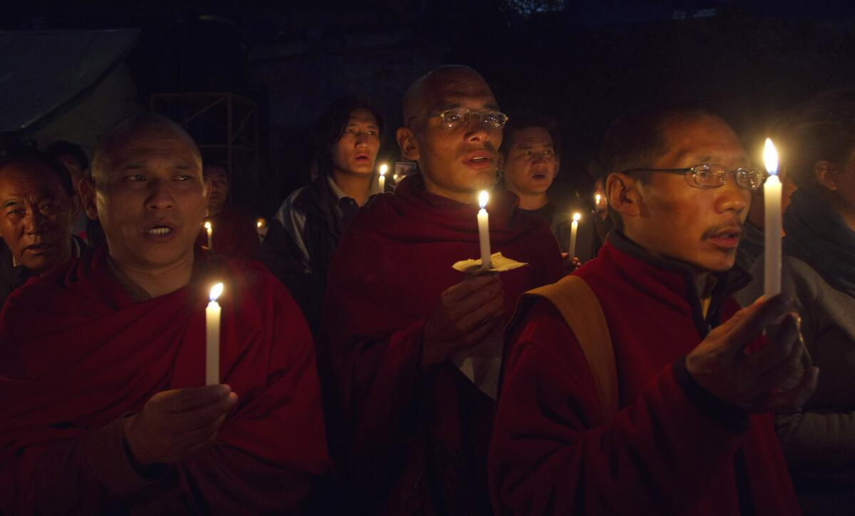 Tibetan exiles in Dharamsala, India, hold a vigil on Oct. 22, the day a Tibetan named Dhondup died after setting himself ablaze in China's Gansu province.