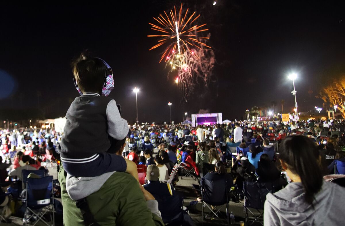 Hundreds of guests watch a fireworks show at the Orange County fairgrounds on July 3.