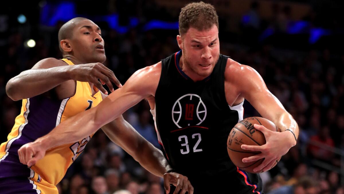 Clippers forward Blake Griffin drives to the basket against Lakers forward Metta World Peace during their game Wednesday.