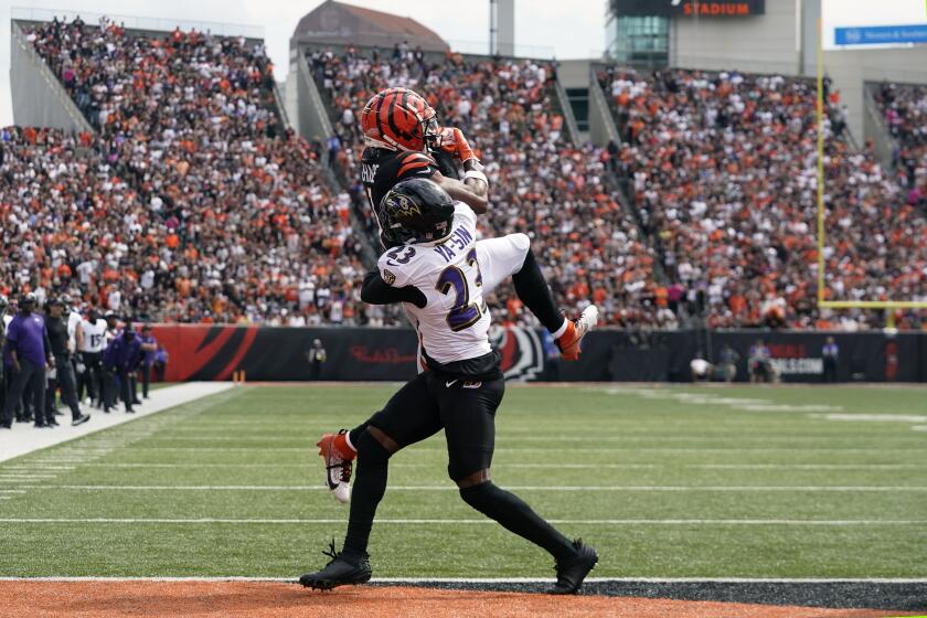 Baltimore Ravens cornerback Rock Ya-Sin (23) breaks up a pass intended for Cincinnati Bengals wide receiver Ja'Marr Chase during the first half of an NFL football game Sunday, Sept. 17, 2023, in Cincinnati. (AP Photo/Darron Cummings)