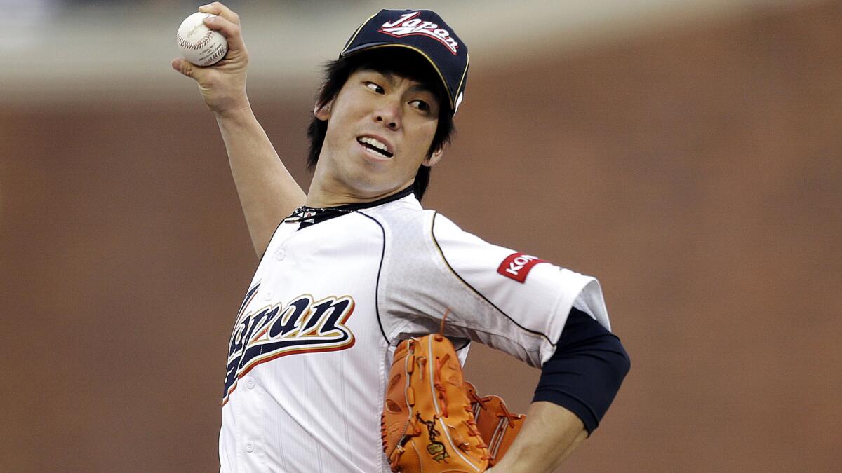 Japan's Kenta Maeda delivers a pitch during the first inning against Puerto Rico in a World Baseball Classic semifinal on March 17, 2013.