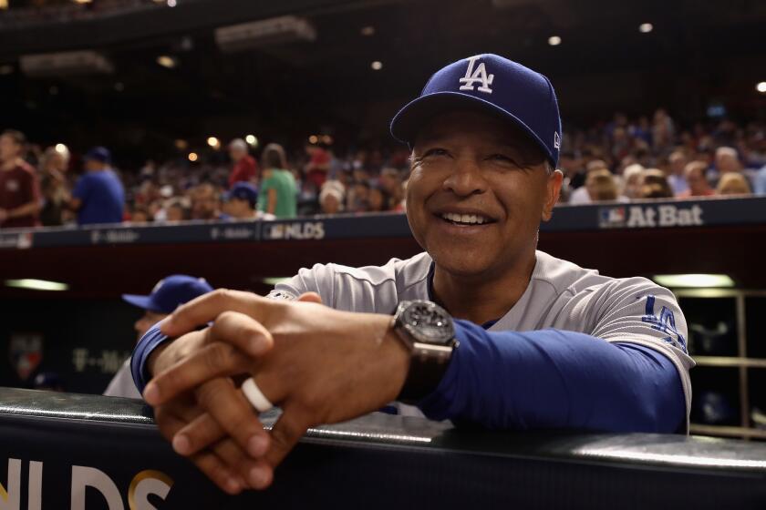 PHOENIX, AZ - OCTOBER 09: Manager Dave Roberts #30 of the Los Angeles Dodgers smiles before the start of the National League Divisional Series game three against the Arizona Diamondbacks at Chase Field on October 9, 2017 in Phoenix, Arizona. (Photo by Christian Petersen/Getty Images) ** OUTS - ELSENT, FPG, CM - OUTS * NM, PH, VA if sourced by CT, LA or MoD **