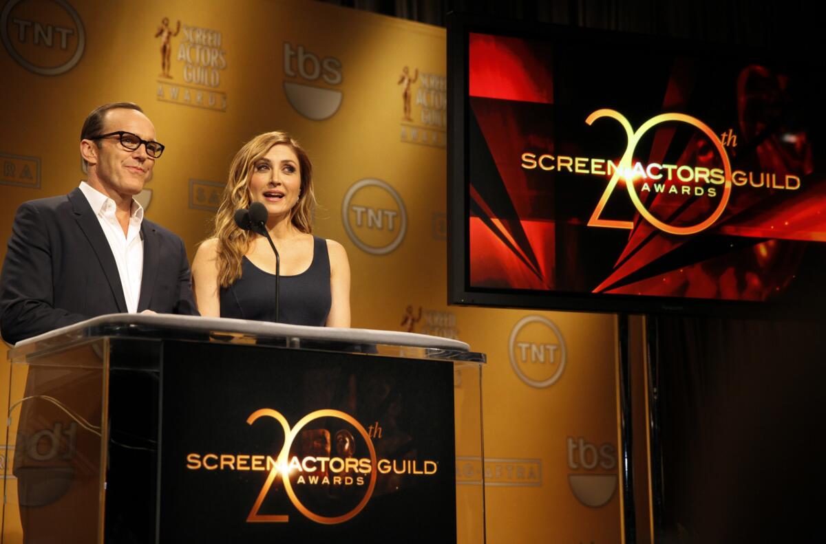 Actors Clark Gregg, left, and Sasha Alexander, right, announce the 20th Annual SAG Awards Nominations at the Pacific Design Center in Los Angeles on December 11, 2013.