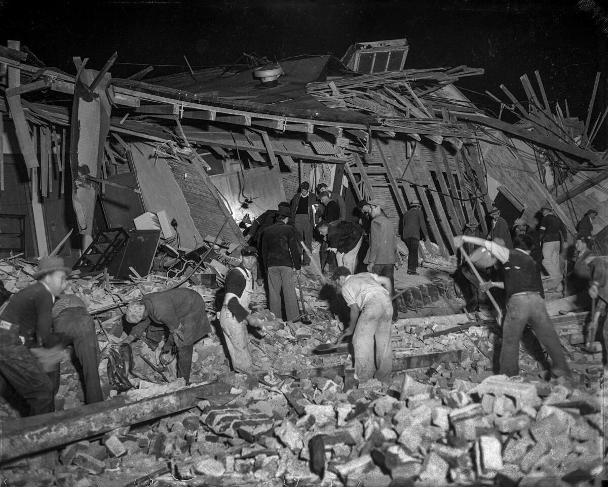 March 10, 1933: Workers going through the rubble of a ruined building after the Long Beach earthquake.