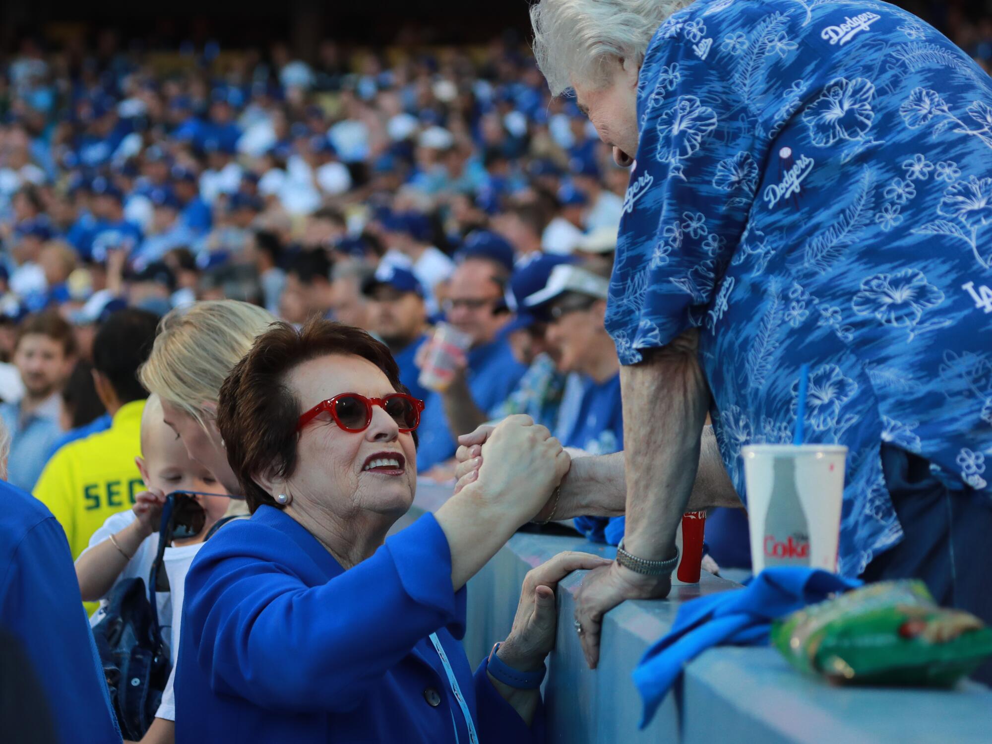 Billie Jean King, left, talks with Rosalind Wyman before a Dodgers in 2018.